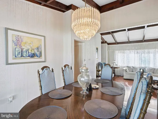 a very nice looking dining room with furniture