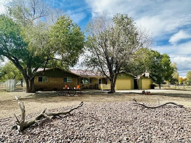 a house with trees in front of it