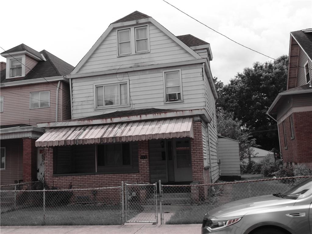 713 Russellwood Avenue McKees Rocks, PA 15136 - Photo 1 of 1 a front view of a house with parking
