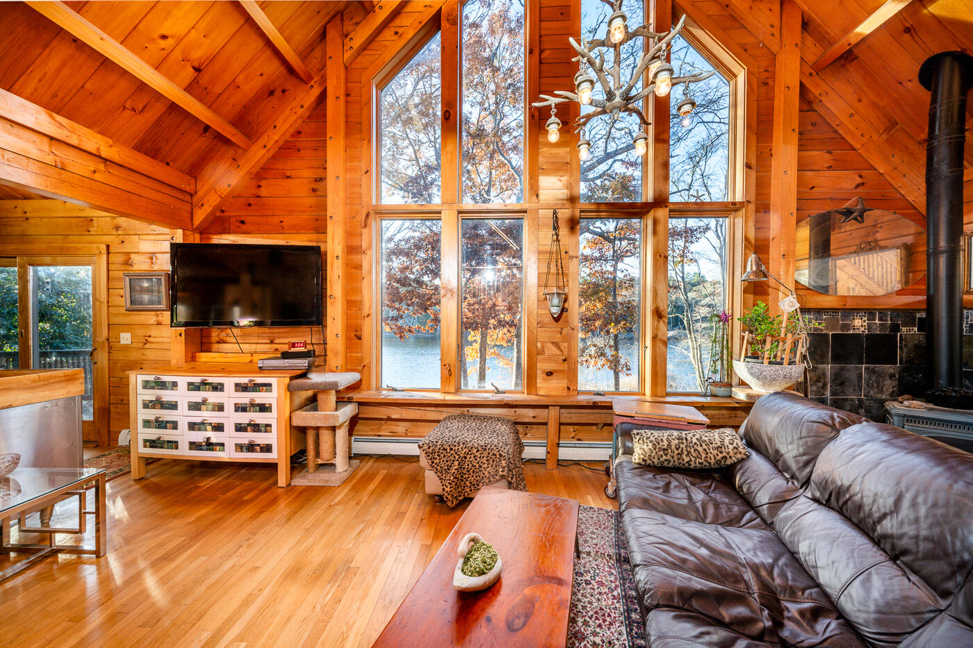 119 Valley Bars Road Bourne, MA 02532 - Photo 4 of 46 a living room with fireplace furniture and a flat screen tv