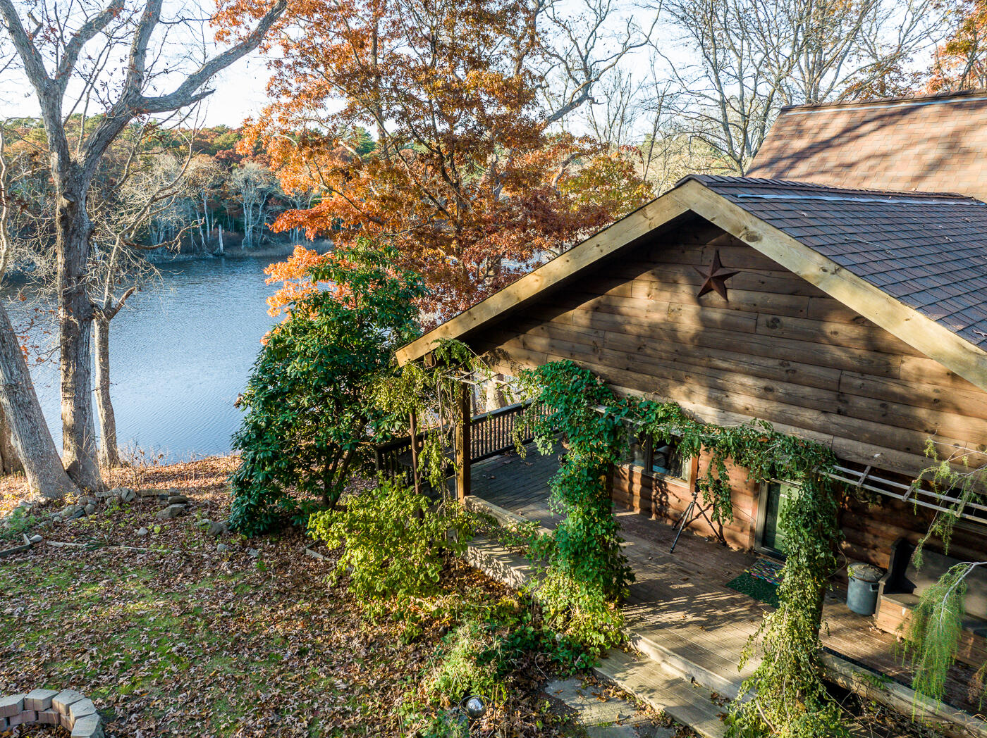 119 Valley Bars Road Bourne, MA 02532 - Photo 41 of 46 a backyard of a house with lots of green space