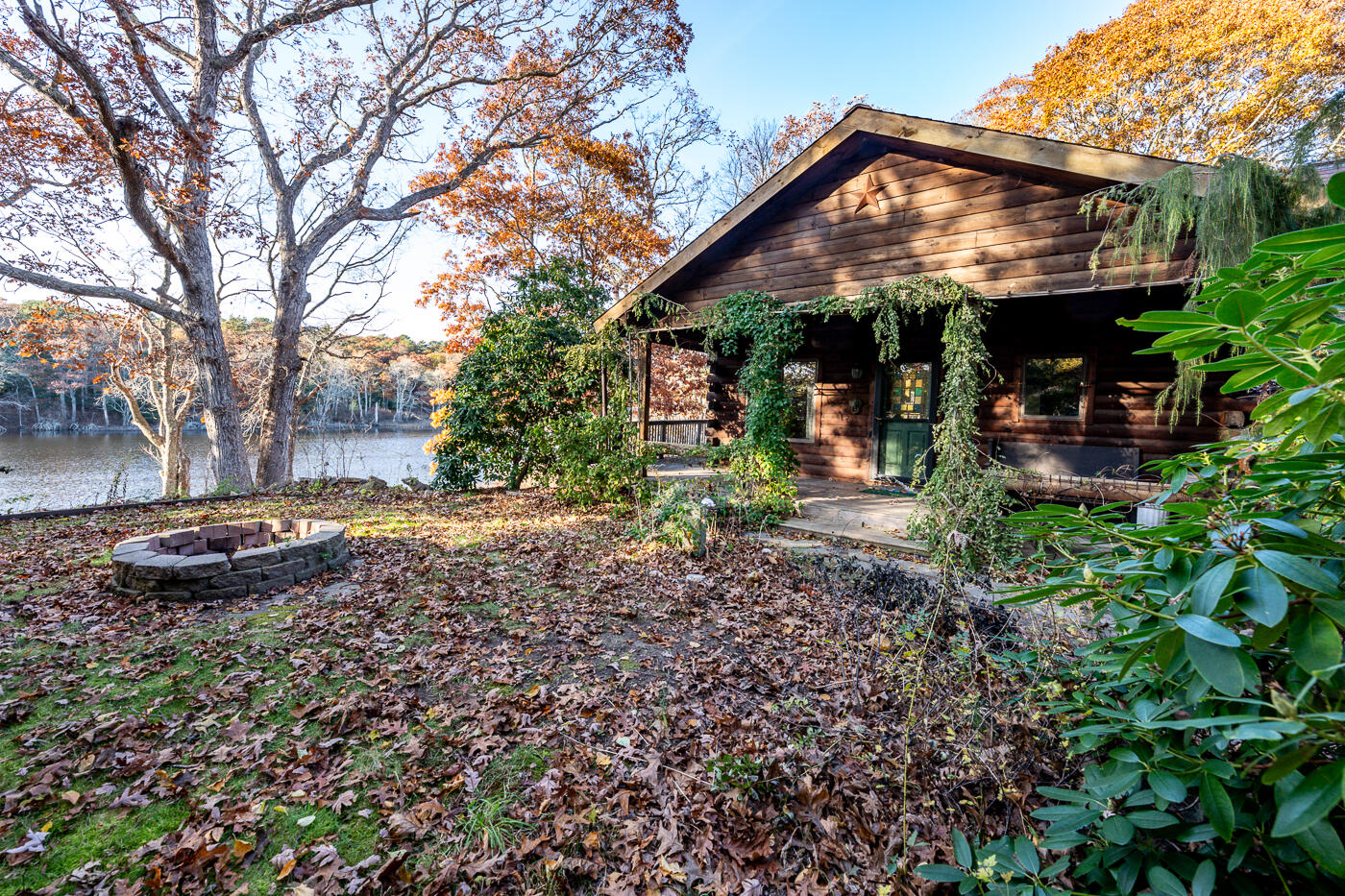 119 Valley Bars Road Bourne, MA 02532 - Photo 44 of 46 a view of a house with backyard and sitting area