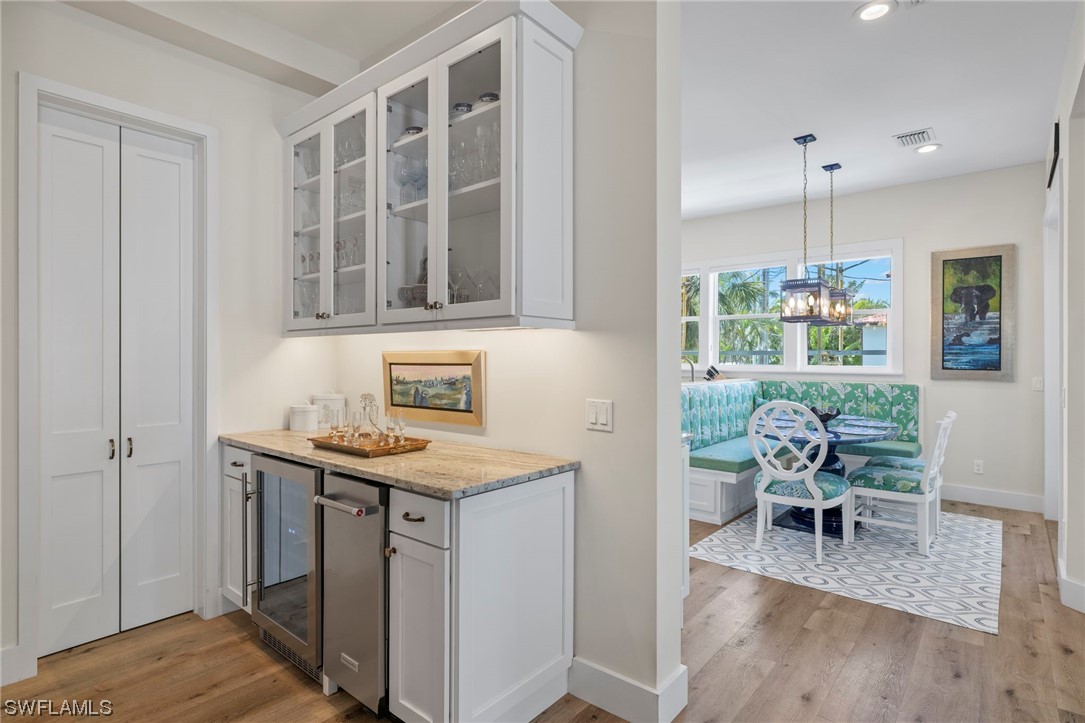 11517 Wightman Lane Captiva, FL 33924 - Photo 11 of 48 a kitchen with a table chairs and entryway