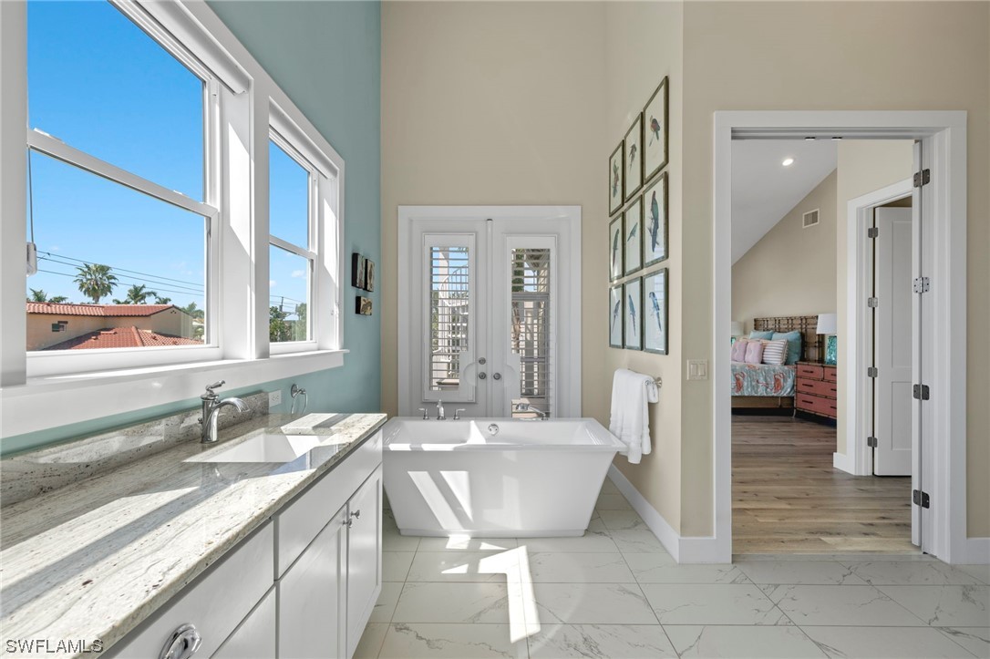 11517 Wightman Lane Captiva, FL 33924 - Photo 16 of 48 a spacious bathroom with a bathtub sink and toilet