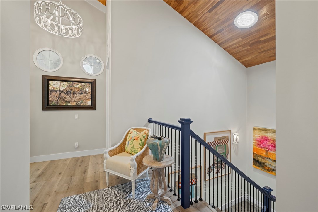 11517 Wightman Lane Captiva, FL 33924 - Photo 21 of 48 a view of a hallway with paintings on the wall