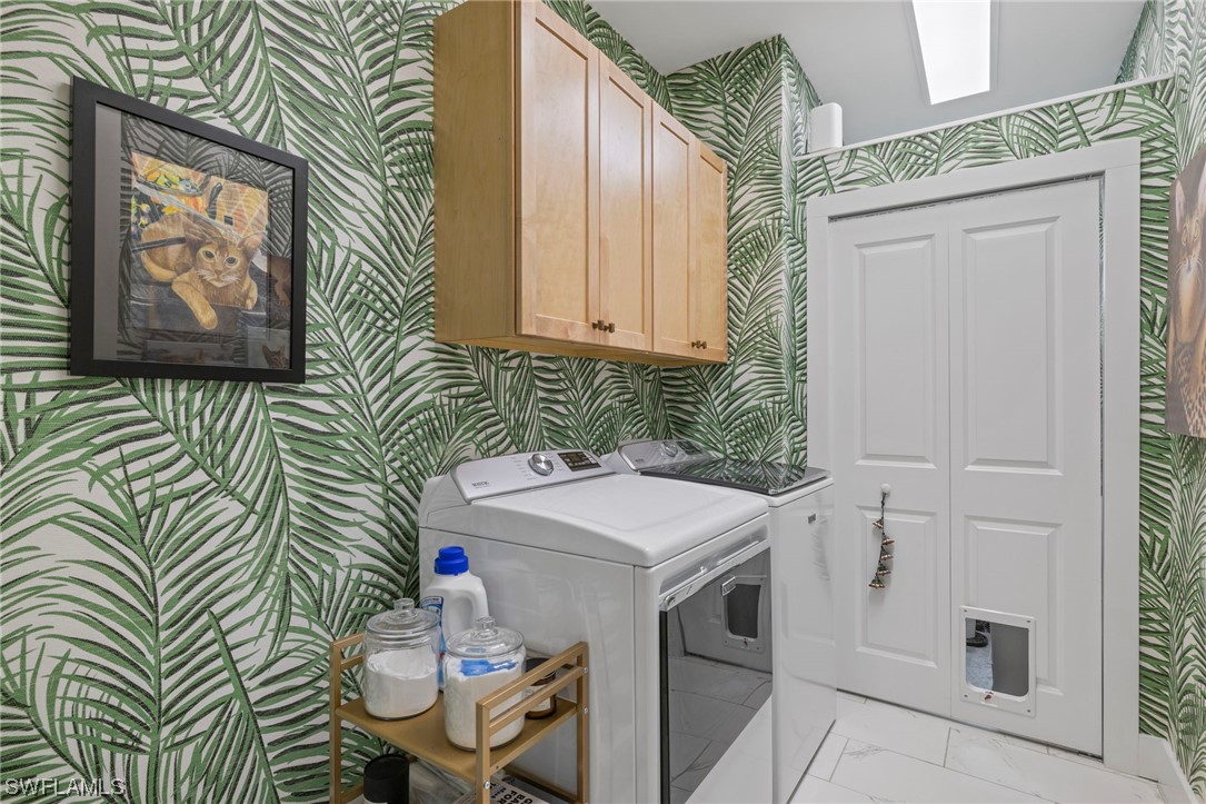 11517 Wightman Lane Captiva, FL 33924 - Photo 28 of 48 a utility room with a sink a washer and dryer