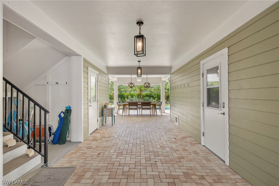 11517 Wightman Lane Captiva, FL 33924 - Photo 29 of 48 a view of a hallway with windows