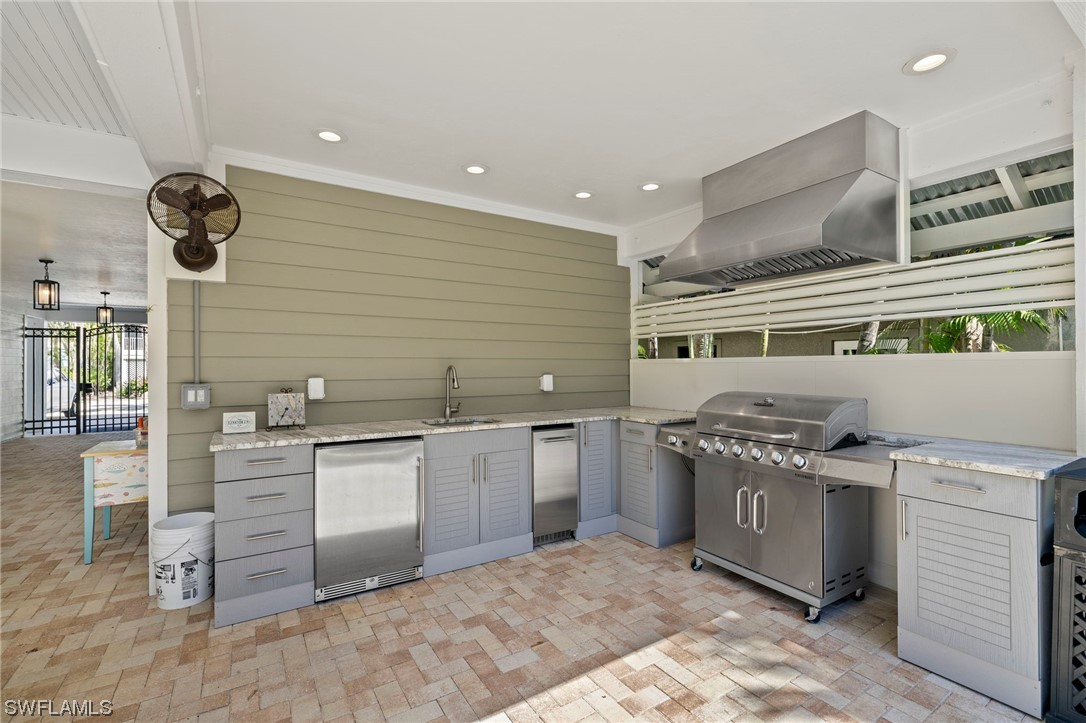 11517 Wightman Lane Captiva, FL 33924 - Photo 32 of 48 a kitchen with stainless steel appliances granite countertop a stove and a sink