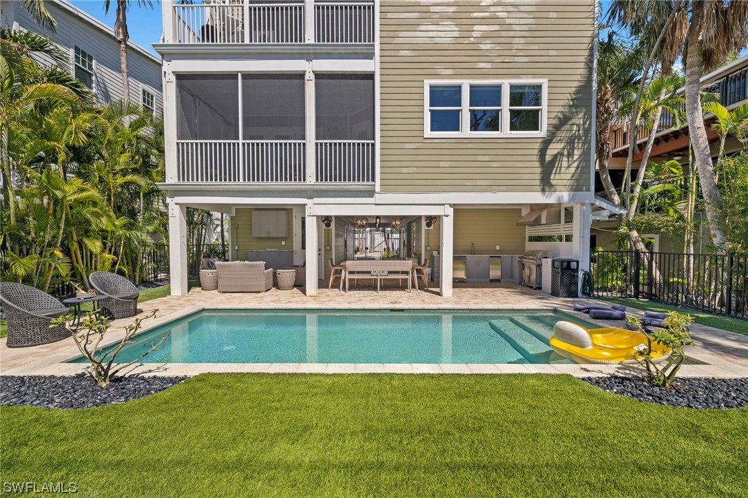 11517 Wightman Lane Captiva, FL 33924 - Photo 34 of 48 a view of a house with swimming pool and sitting area