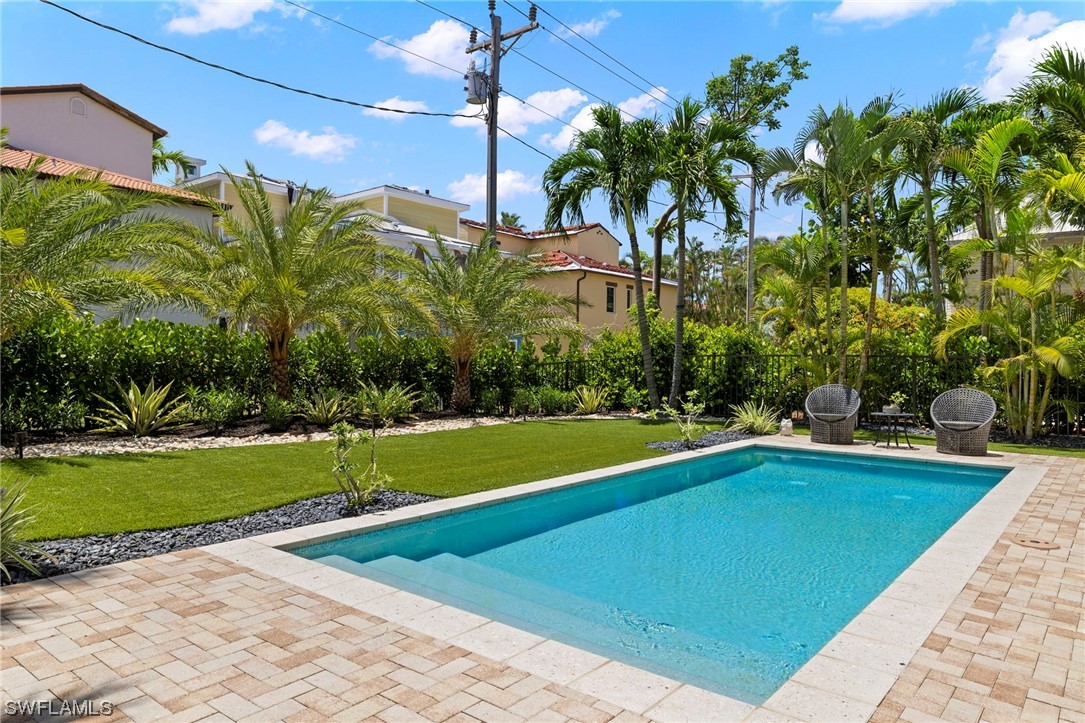 11517 Wightman Lane Captiva, FL 33924 - Photo 37 of 48 a view of a swimming pool with a yard