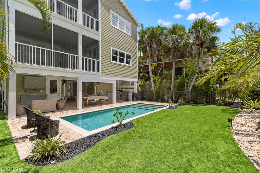 11517 Wightman Lane Captiva, FL 33924 - Photo 38 of 48 a view of a house with a yard and sitting area