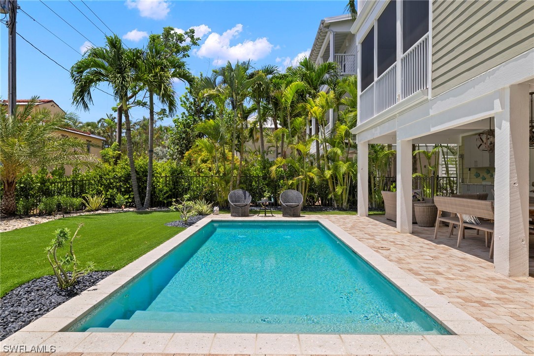 11517 Wightman Lane Captiva, FL 33924 - Photo 39 of 48 a view of swimming pool with a garden and patio