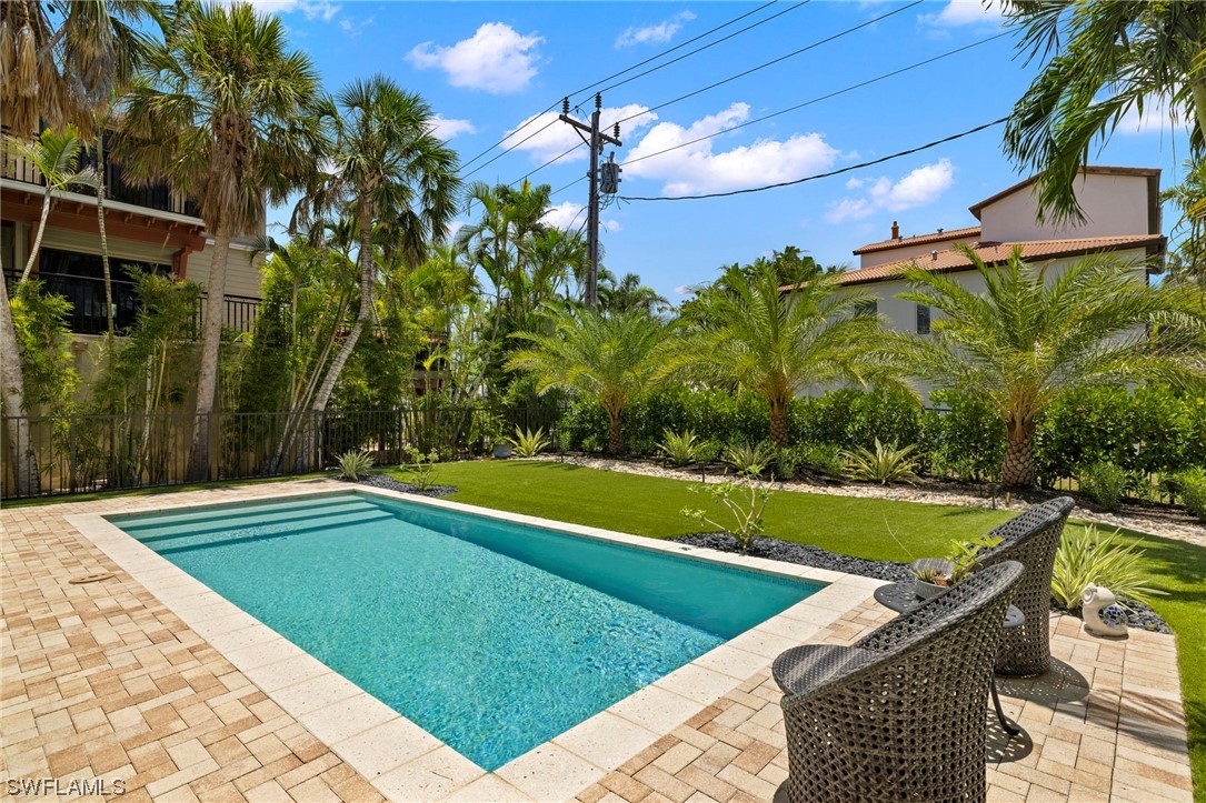 11517 Wightman Lane Captiva, FL 33924 - Photo 40 of 48 a view of a swimming pool with a yard