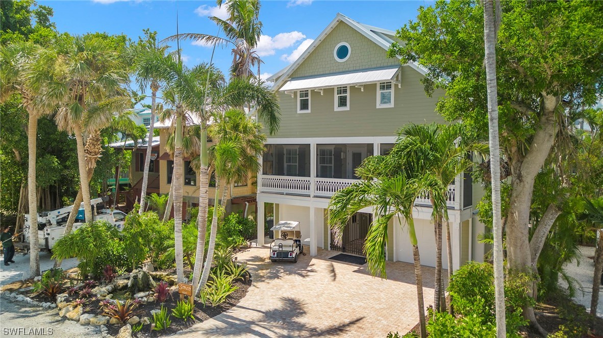 11517 Wightman Lane Captiva, FL 33924 - Photo 48 of 48 aerial view of a house with a yard and potted plants