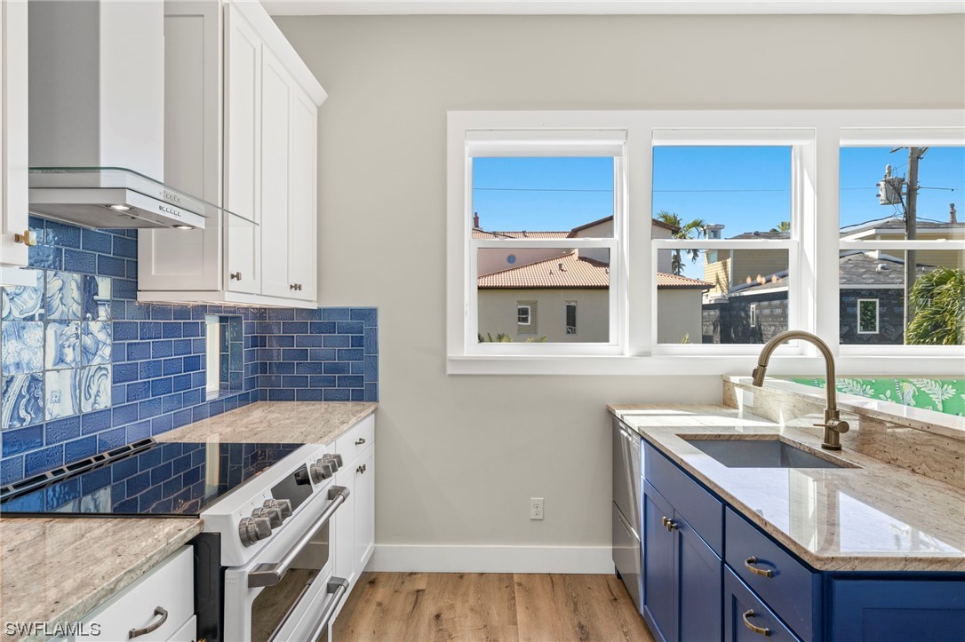 11517 Wightman Lane Captiva, FL 33924 - Photo 5 of 48 a kitchen with stainless steel appliances granite countertop a sink stove and cabinets