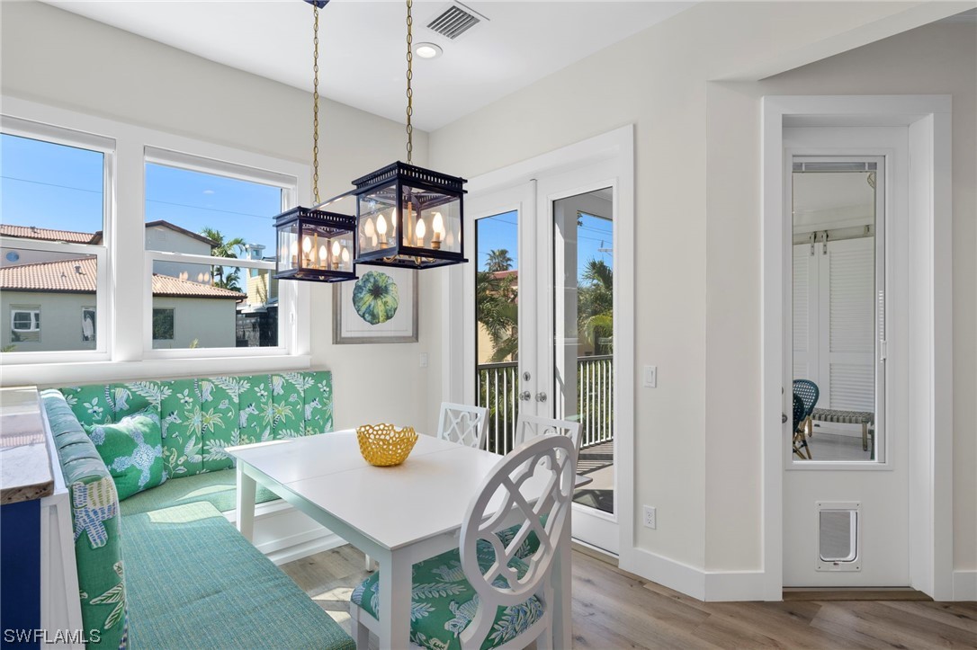 11517 Wightman Lane Captiva, FL 33924 - Photo 7 of 48 a view of a dining room with furniture window and wooden floor