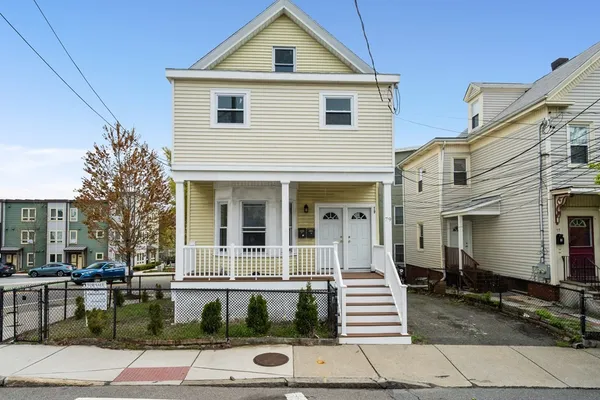 a front view of a house with a yard