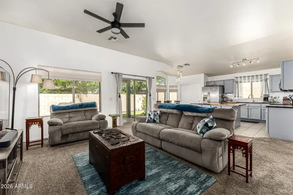 a living room with furniture and a large window