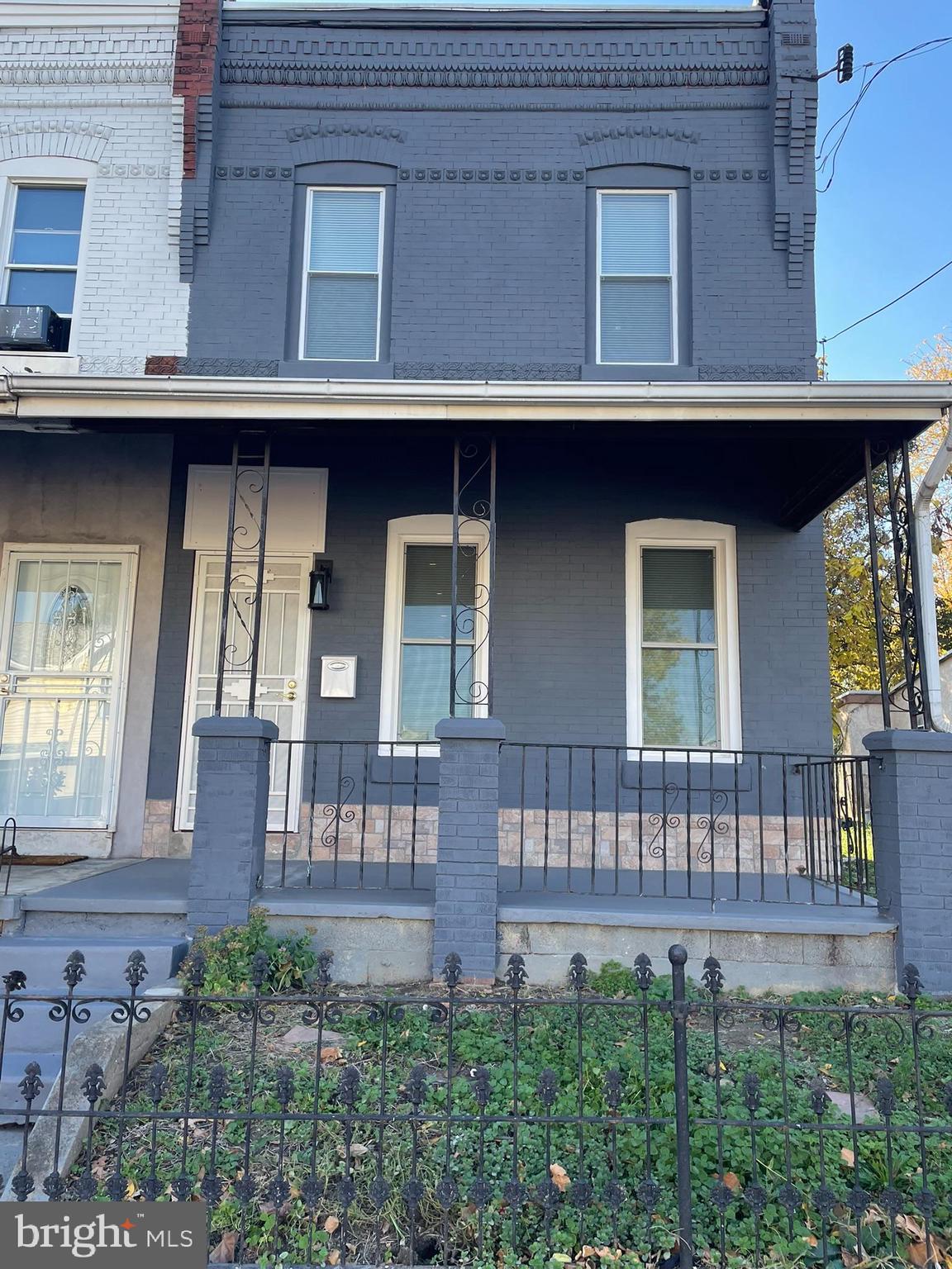 346 Parker Street Chester, PA 19013 - Photo 1 of 32 a view of a house with large windows and a table and chairs