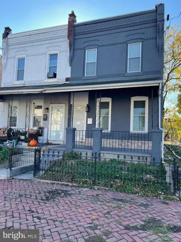 a front view of a building with garden
