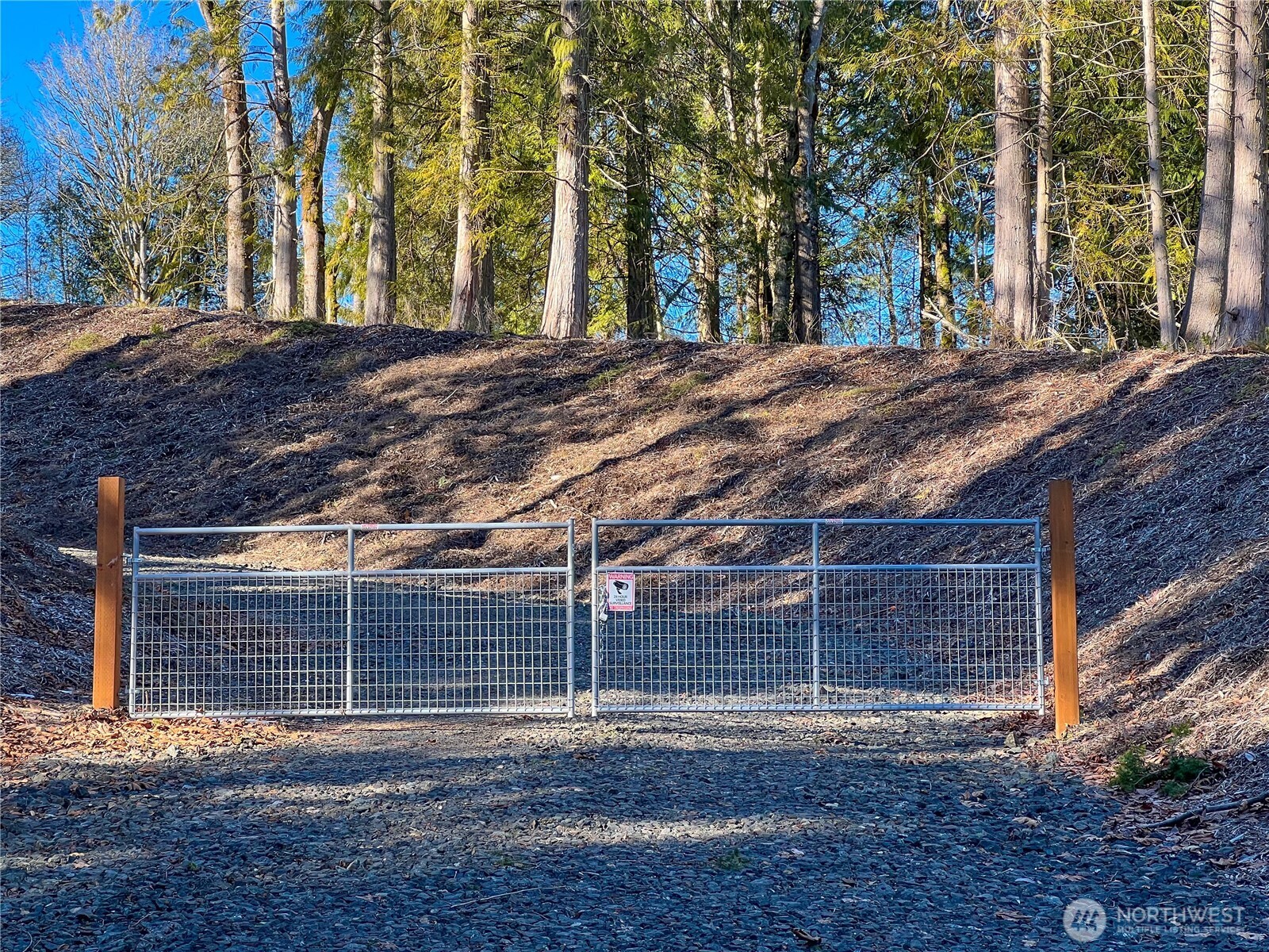 2998 Oak Bay Road Port Hadlock, WA 98339 - Photo 2 of 28 a view of a backyard with wooden fence