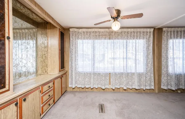 a view of an empty room and window