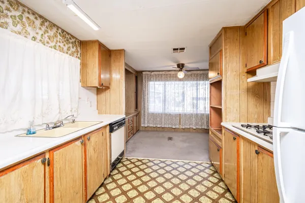 a bathroom with a sink a mirror and a shower