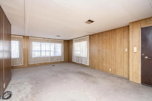 a view of an empty room with a window