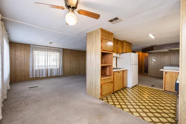 a view of a kitchen with furniture and a window