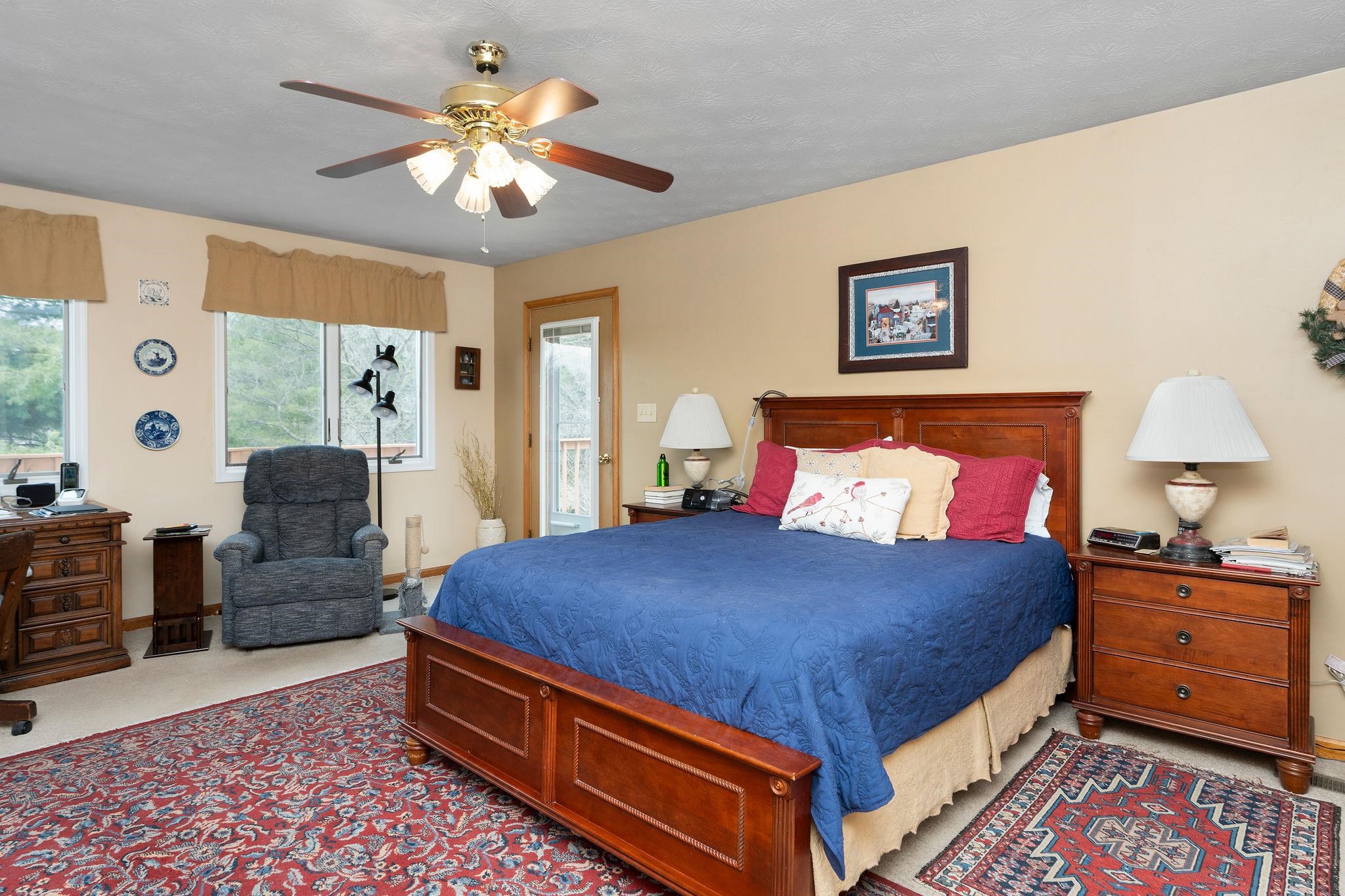 53 Fort River Road Verona, VA 24482 - Photo 24 of 75 a bedroom with a bed and a chandelier