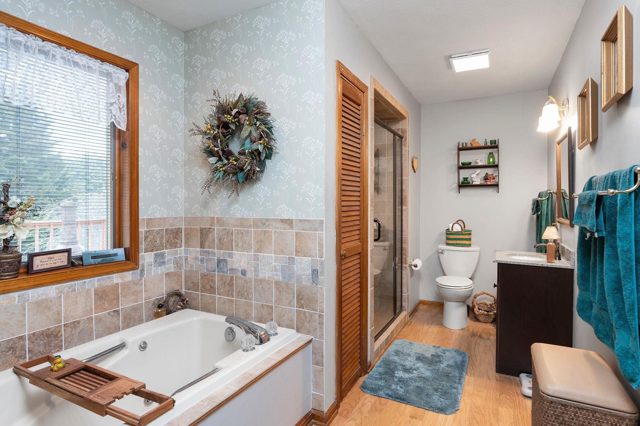 53 Fort River Road Verona, VA 24482 - Photo 28 of 75 a bathroom with a bathtub and a shower
