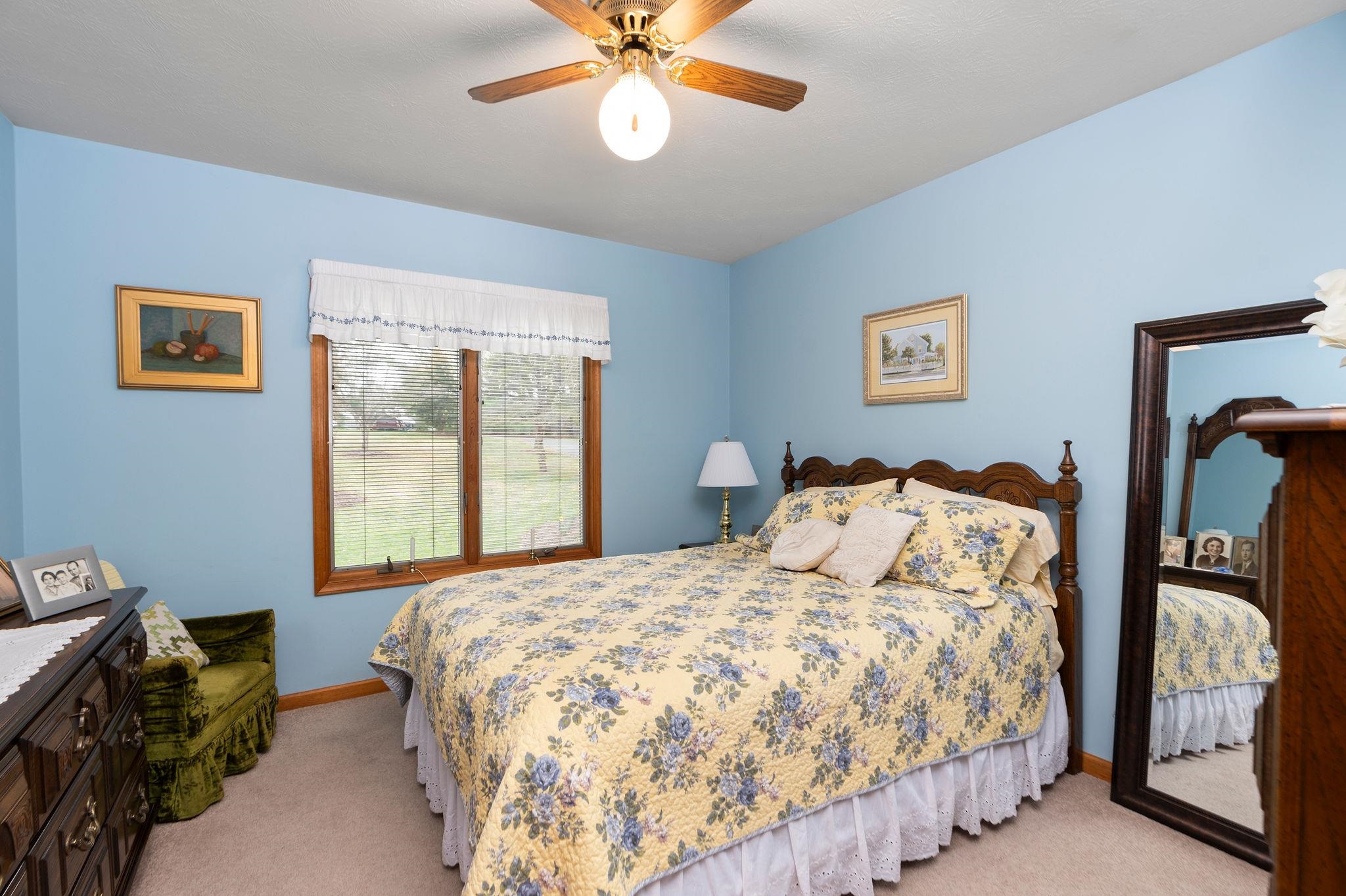 53 Fort River Road Verona, VA 24482 - Photo 32 of 75 a bedroom with a bed and a chandelier