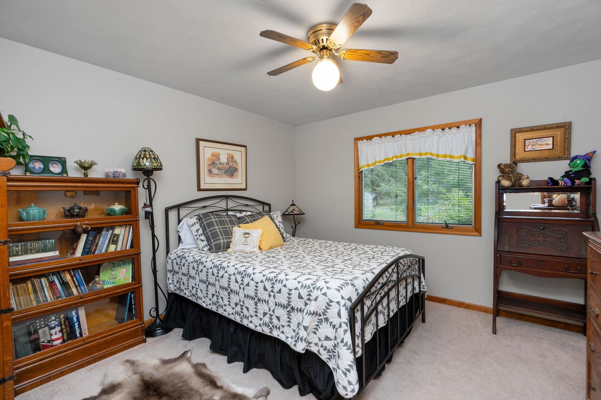 53 Fort River Road Verona, VA 24482 - Photo 34 of 75 a bedroom with a bed bookshelf and a window