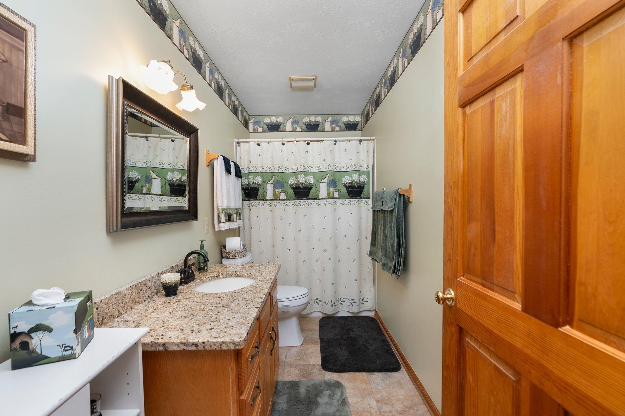 53 Fort River Road Verona, VA 24482 - Photo 38 of 75 a bathroom with a granite countertop sink and a mirror