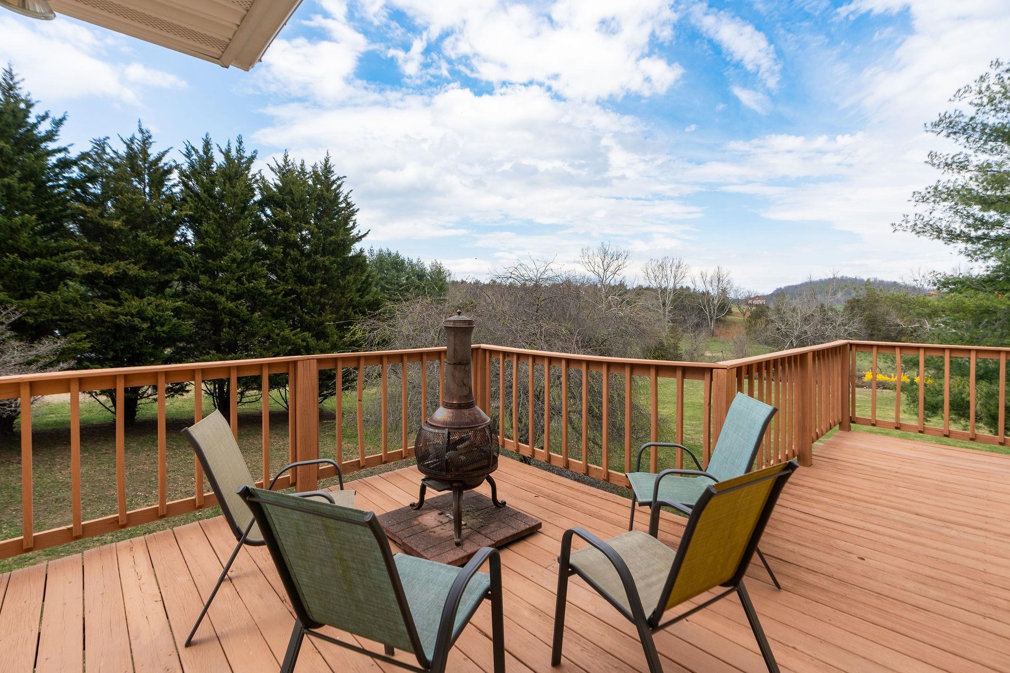 53 Fort River Road Verona, VA 24482 - Photo 41 of 75 a view of a balcony with wooden floor and outdoor seating