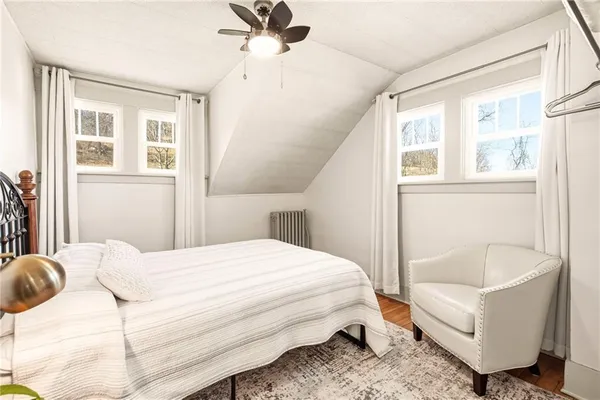 a bedroom with a bed and a couch