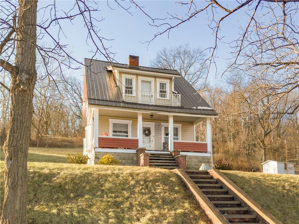 2237 Ridgeview Road Mount Pleasant, PA 15666 - Photo 2 of 39 a front view of a house with a yard