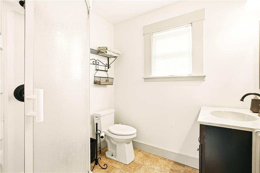 2237 Ridgeview Road Mount Pleasant, PA 15666 - Photo 21 of 39 a bathroom with a toilet sink a mirror and shower