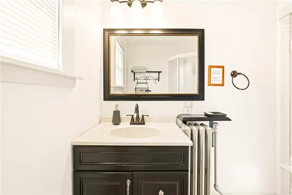 a bathroom with a sink and a mirror