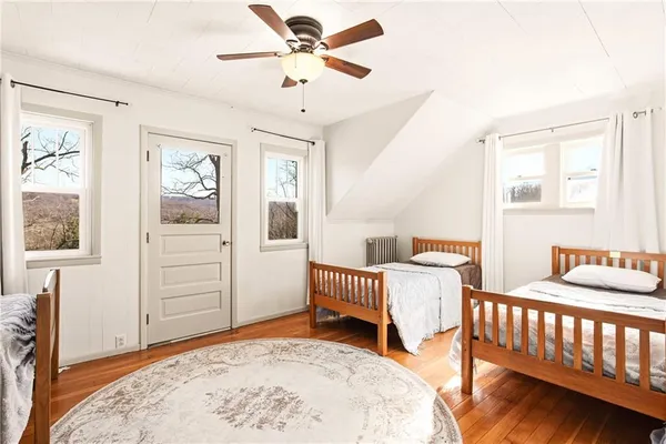 a bedroom with furniture and window