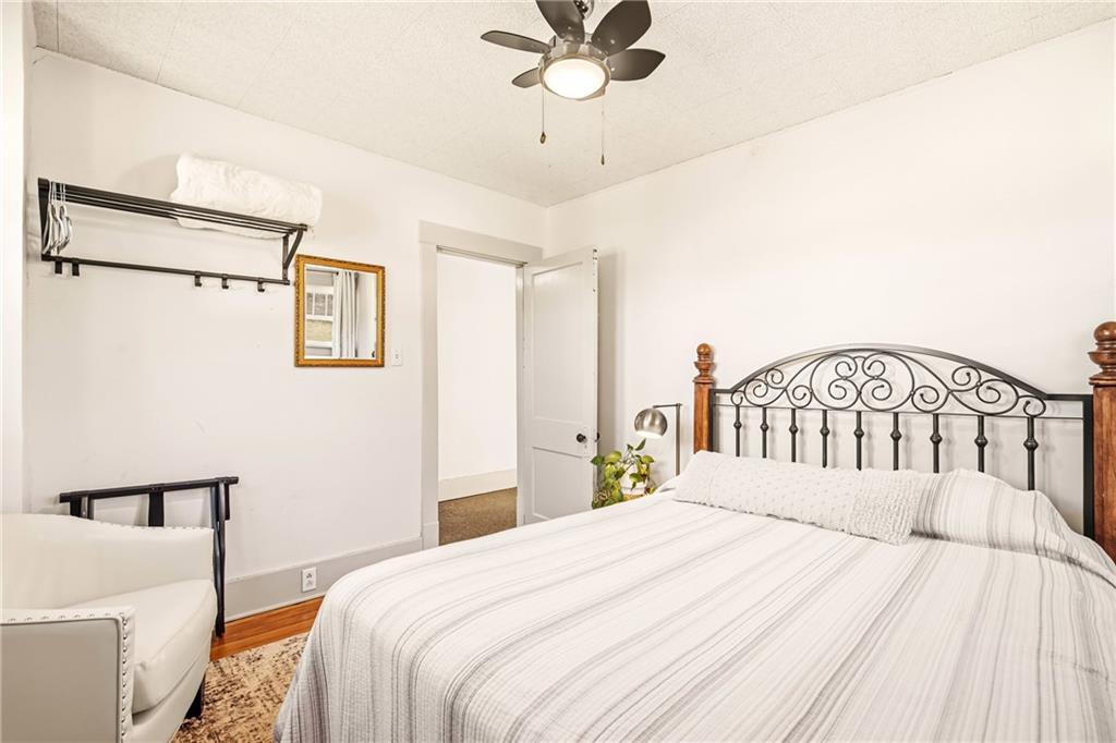 2237 Ridgeview Road Mount Pleasant, PA 15666 - Photo 27 of 39 a bedroom with a bed and a chandelier