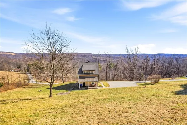 a swimming pool with trees in front of it