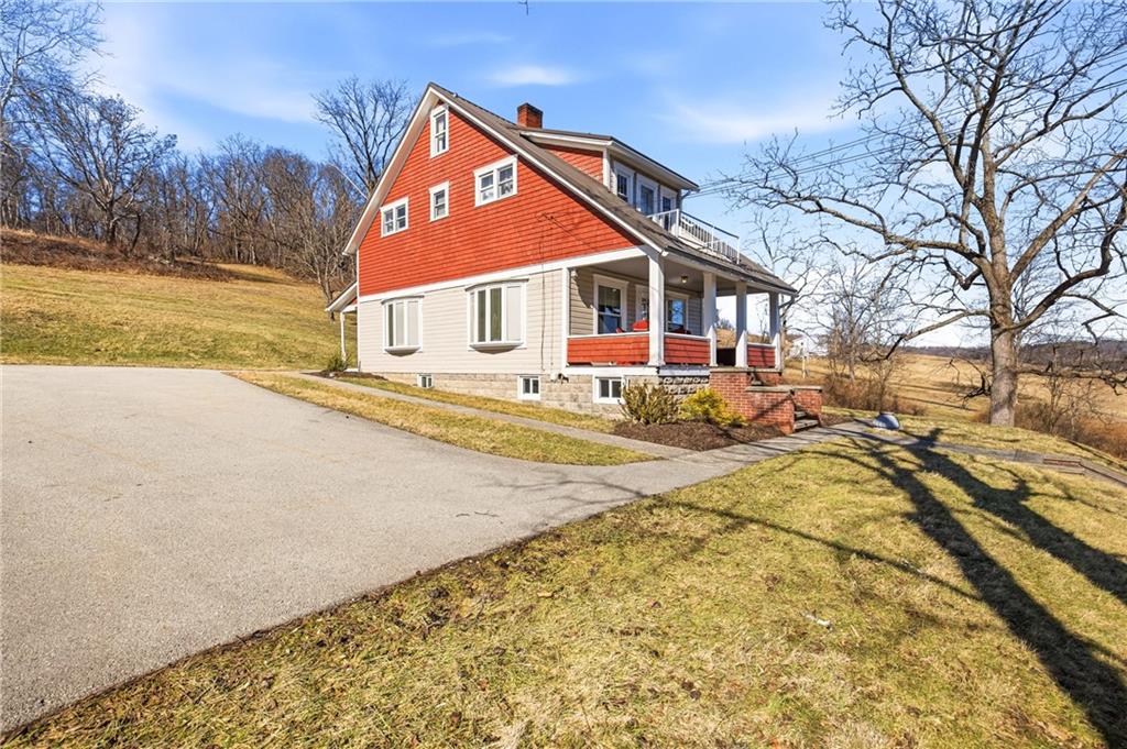 2237 Ridgeview Road Mount Pleasant, PA 15666 - Photo 3 of 39 a front view of a house with a yard and garage