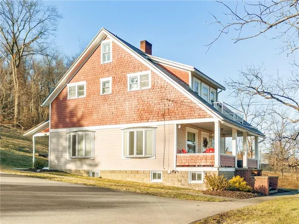 a house with trees in front of it