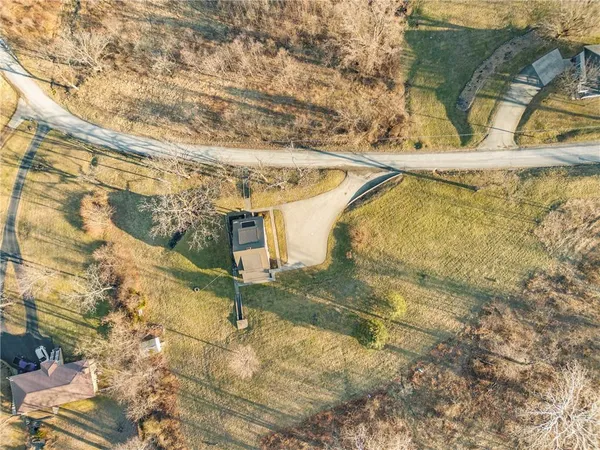 a view of a large building with large tree