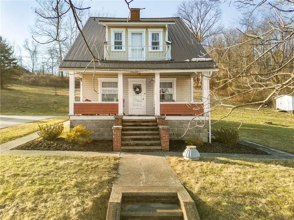 front view of a house with a yard