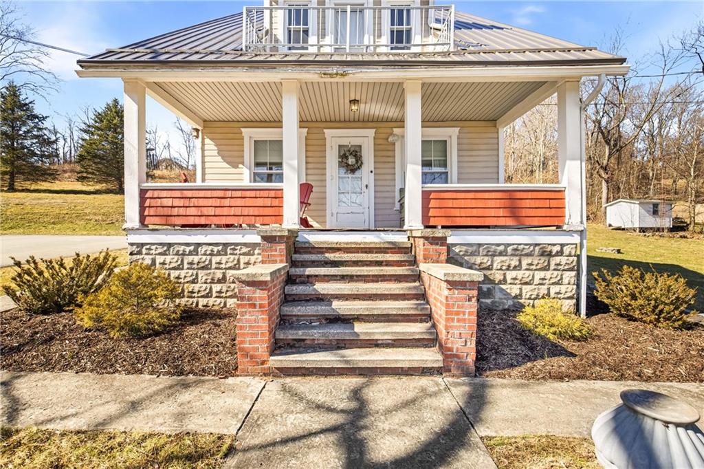 2237 Ridgeview Road Mount Pleasant, PA 15666 - Photo 5 of 39 a front view of a house with a large window