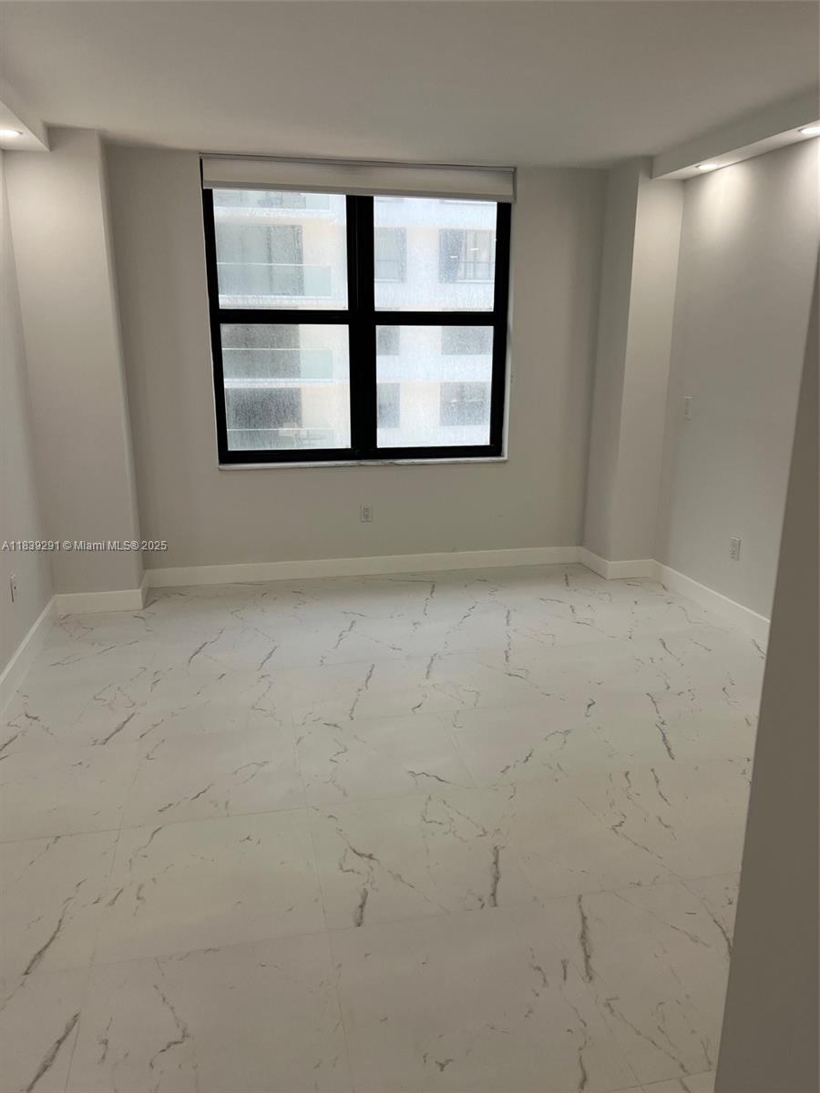 9801 Collins Avenue, Unit 15X/COMPLETE Bal Harbour, FL 33154 - Photo 17 of 24 a view of an empty room with a window