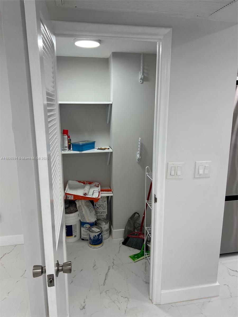 9801 Collins Avenue, Unit 15X/COMPLETE Bal Harbour, FL 33154 - Photo 23 of 24 a room with storage and utility