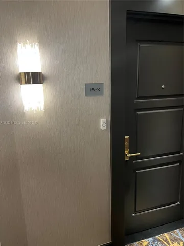 a kitchen with stainless steel appliances a stove a sink a microwave a refrigerator and cabinets